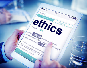 Man Reading the Definition of Ethics
