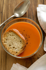 tomato soup in bowl with bread