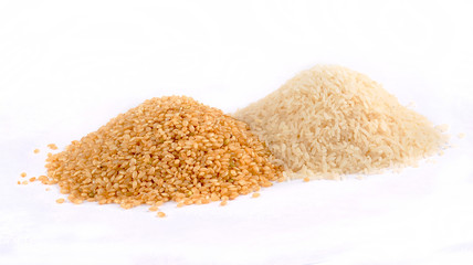 Piles of white and brown rice