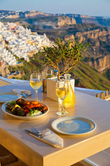 Dinner for two on a sunset background