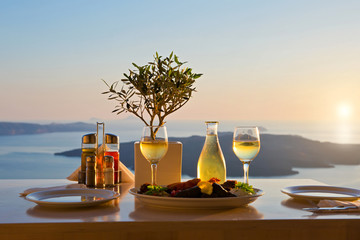 Dinner for two on a sunset background