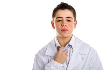 Handsome boy doctor in white coat while undressing