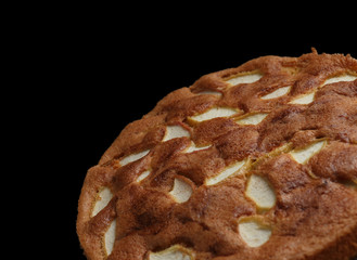 Apple sponge cake isolated on black background