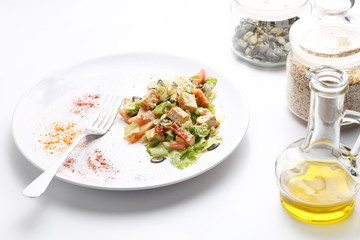 Tofu and vegetables salad. Olive oil, spices, pumpkin and sesame