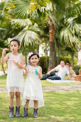 Blowing soap bubbles at the picnic