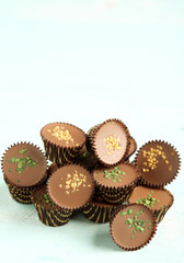 Tasty chocolate candies on wooden table