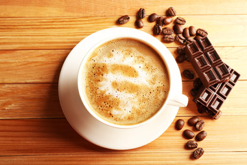 Cup of coffee latte art with grains and chocolate