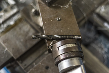 Metal drill bit on industrial lathe machine
