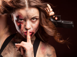 Woman warrior posing with knife. Ready to fight. With dirty face