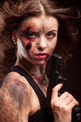 Woman warrior posing with knife. Ready to fight. With dirty face