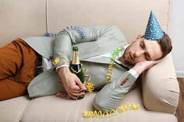 Young man on couch after fun close up