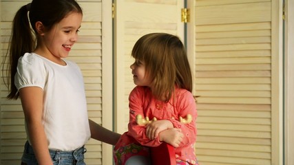 Children ride on toy horse