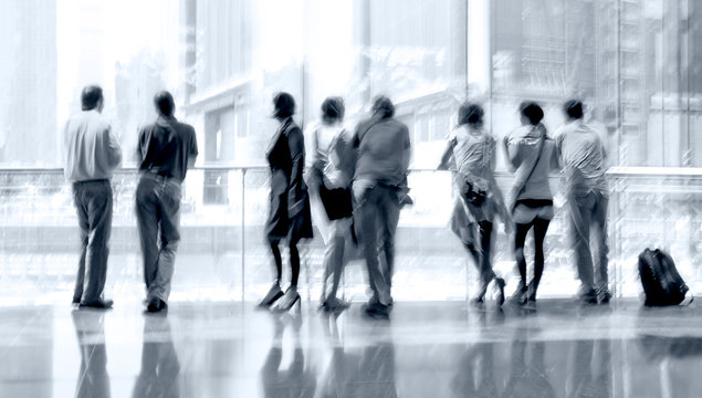 abstract image of people in the lobby of a modern business cente