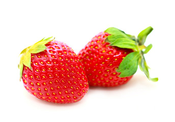Strawberries with leaves. Isolated on a white background. 