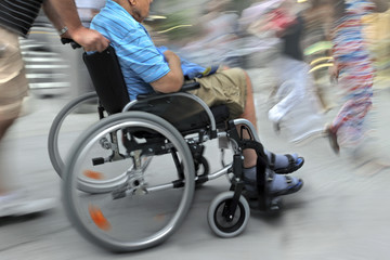 Obraz na płótnie Canvas blurred movement disabled on a city street