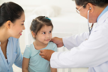 Examining little girl