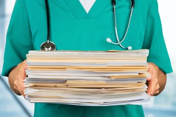 Healthcare And Medicine. Doctor holding Medical Files