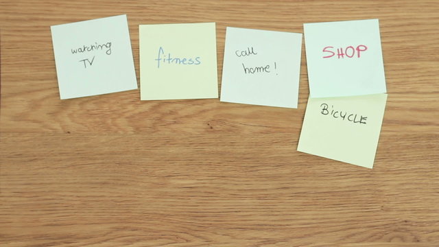 Office desk covered with different post it papers, time lapse