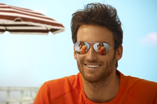 Happy Handsome Casual Man Wearing Mirror Shades