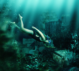 Woman swimming underwater. Adventure