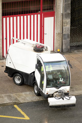 worker with street sweeper electrical  vehicle cleaning