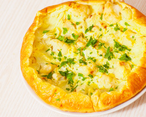 omelet with cheese and cauliflower on a white plate