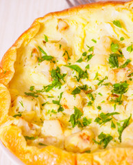 omelet with cheese and cauliflower on a white plate