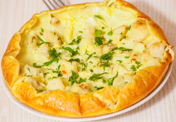 omelet with cheese and cauliflower on a white plate