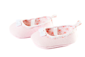 Close up pink baby shoes warm