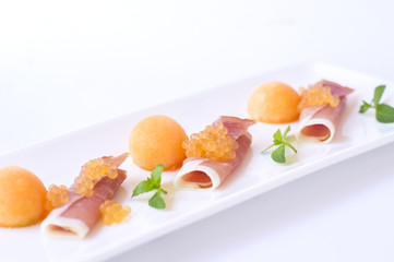 Molecular melon caviar, prosciutto and fresh melon