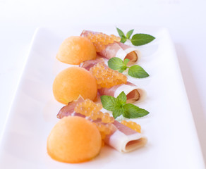 Molecular melon caviar, prosciutto and fresh melon