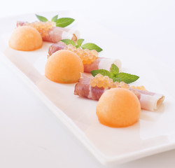 Molecular melon caviar, prosciutto and fresh melon