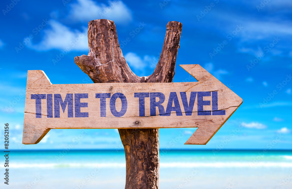 Wall mural Time To Travel wooden sign with beach background