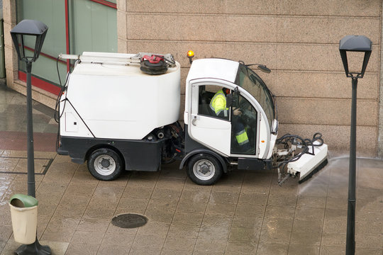 Worker With Street Sweeper Electrical  Vehicle Cleaning