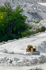Bulldozer on White Road of Marble Mine