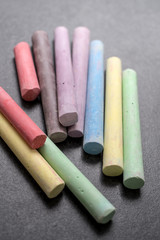 Colored chalk on a blackboard background