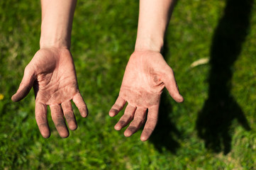 Dirty hands covered in dirt