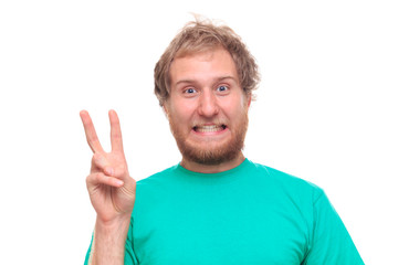 Fototapeta premium Bearded happy man showing victory sign