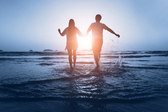loving couple enjoy the sea at sunset