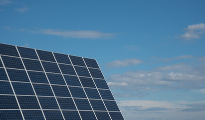Solar energy panels against a blue sky