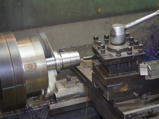 operator turning mold parts by manual lathe