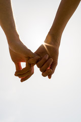 Romantic couple with clasped hands - obrazy, fototapety, plakaty