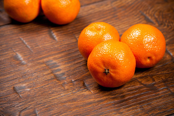 Tangerines on wooden table