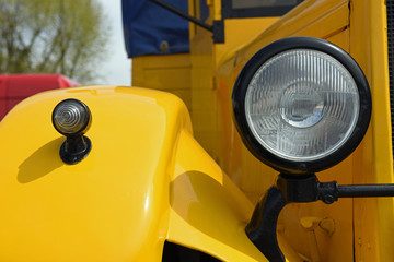 Spotlight on yellow retro car