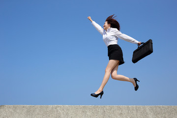 Successful business woman jump