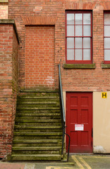 Steps up to bricked up doorway