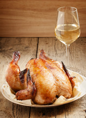 baked chicken on a plate with pita bread