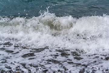 Sea waves on a pebbly shore