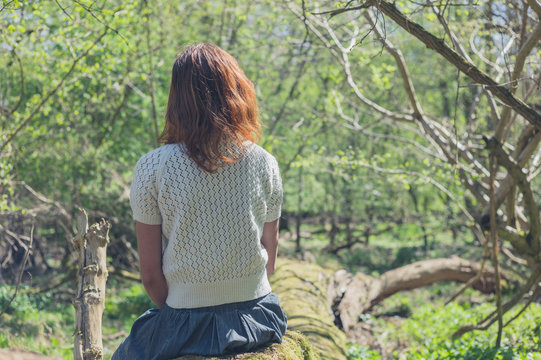 Young woman exploring a forest