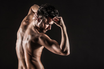 Obraz na płótnie Canvas The Muscular Young Sexy Naked Cute Man